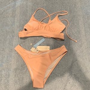 Cup she. Size small. Brand new with tags never worn. Bathing suit.
